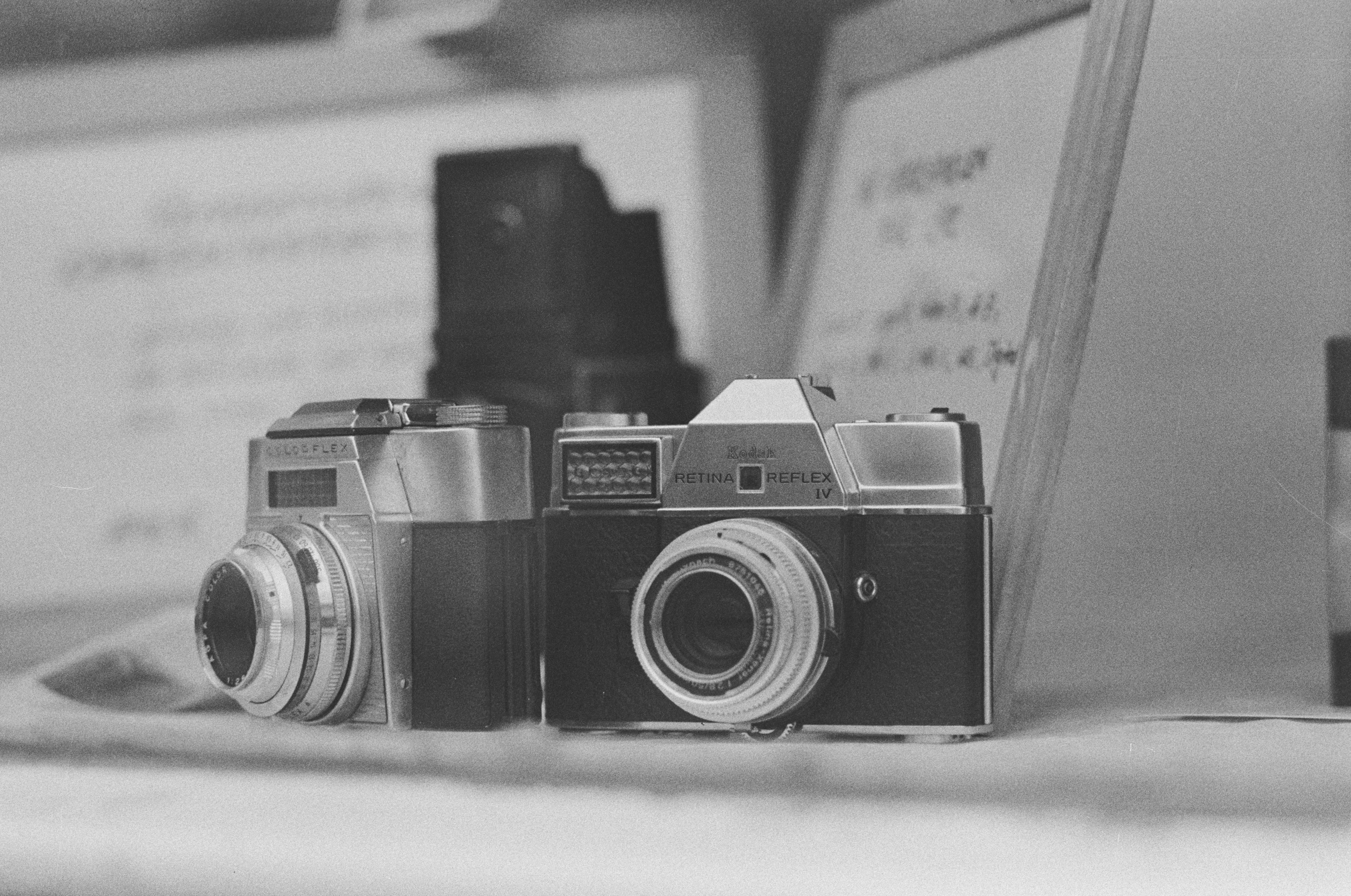 black and silver camera on white table